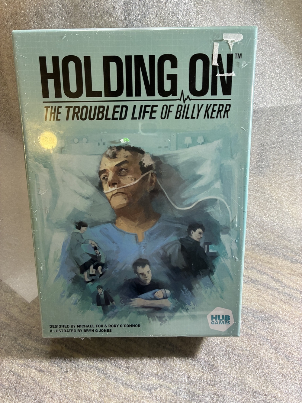 Holding On: The Troubled Life of Billy Kerr - Board Game (Aqua Cover)
